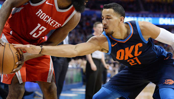 Oklahoma City Thunder guard Andre Roberson (21) attempts to steal the ball from Houston Rockets guard James Harden (13) during the second quarter at Chesapeake Energy Arena.